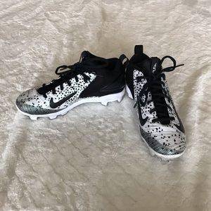 Black and white Nike football shoes